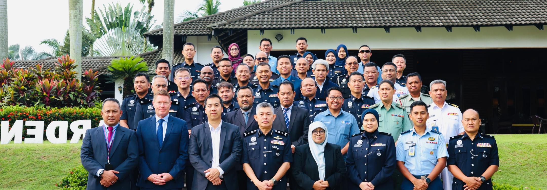 Workshop participants stand for group shot